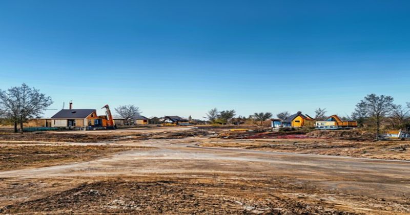 Residential land development site with construction equipmen
